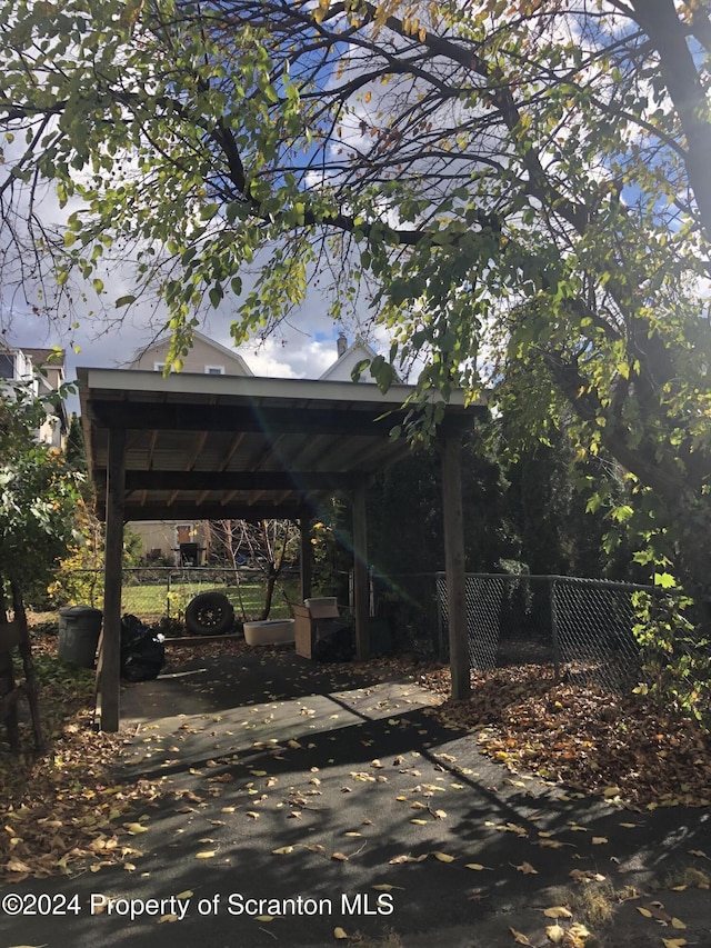 view of parking / parking lot with a carport