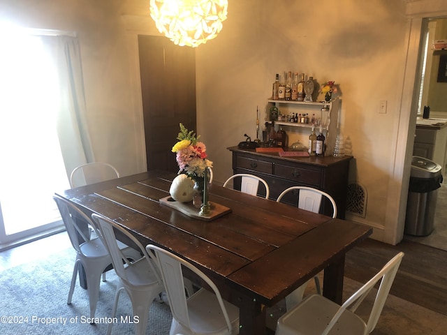 dining room featuring a chandelier and a healthy amount of sunlight