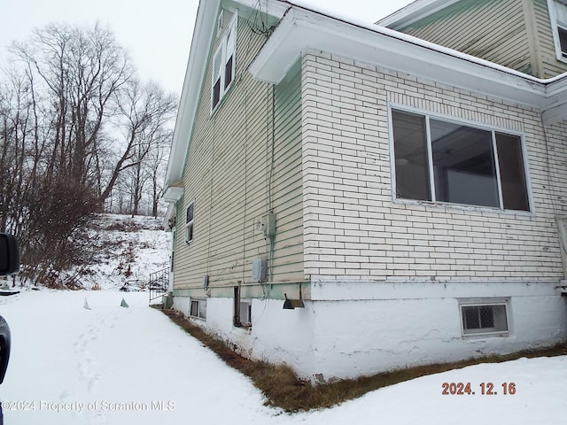 75 Hamlin Hwy, Moscow, PA 18444 - view of snowy exterior featuring brick siding