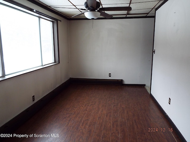 75 Hamlin Hwy, Moscow, PA 18444 - spare room with baseboards, a paneled ceiling, dark wood-style floors, and ceiling fan