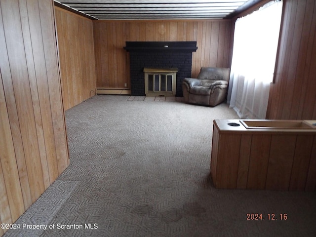 75 Hamlin Hwy, Moscow, PA 18444 - carpeted living area with a baseboard radiator, wood walls, and a fireplace