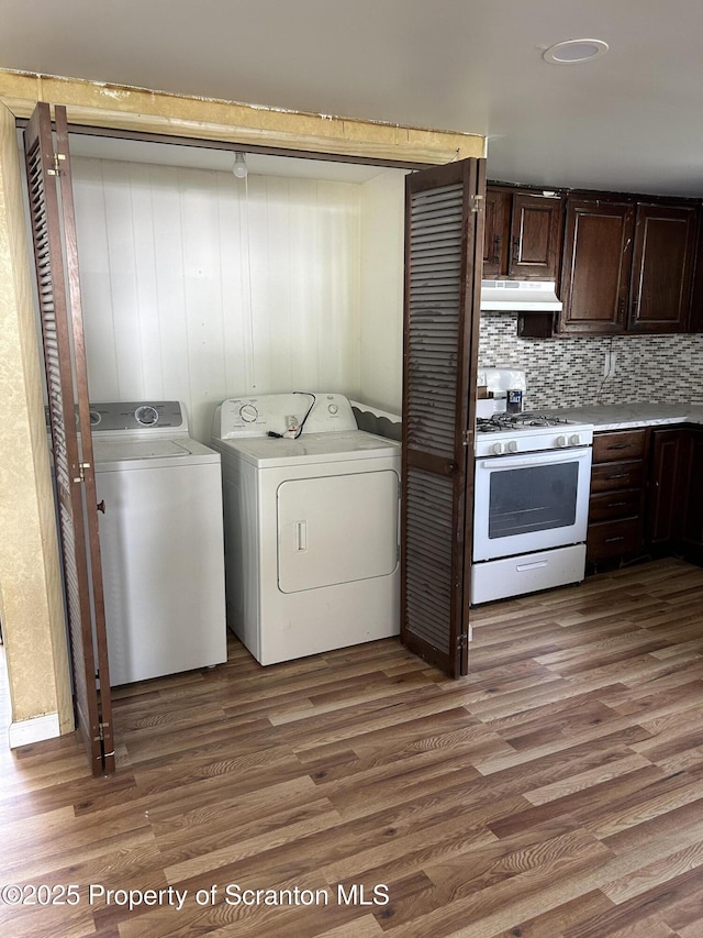 210 Gorham Ave, Mayfield, PA 18433 - clothes washing area with washing machine and dryer and wood finished floors