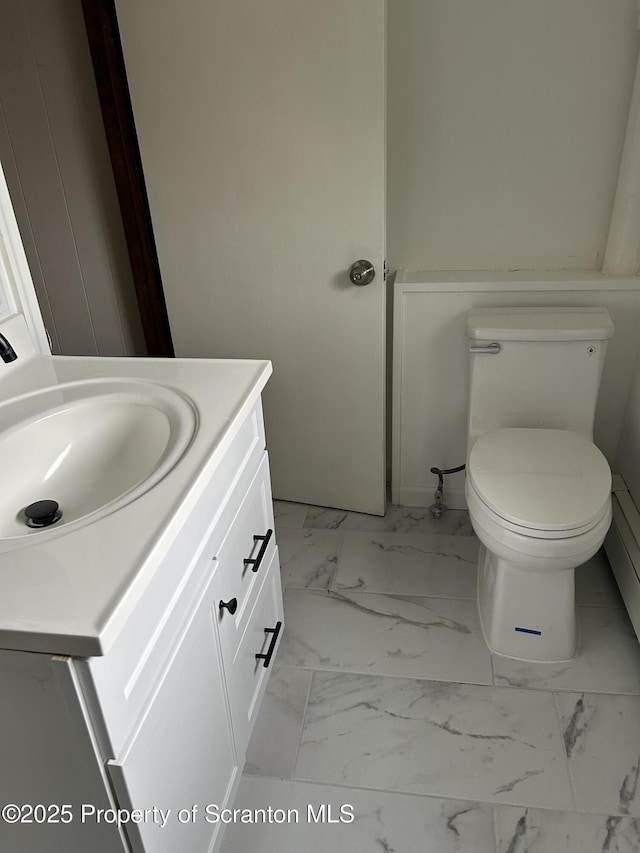 210 Gorham Ave, Mayfield, PA 18433 - half bath featuring marble look tile flooring, vanity, and toilet