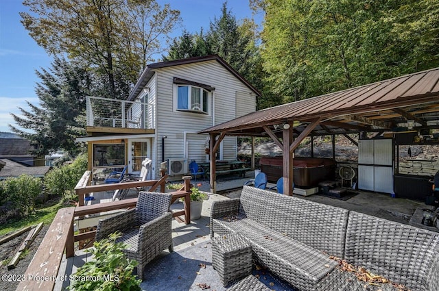 266 Warren Park Rd, New Milford, PA 18834 - view of patio featuring a hot tub, a balcony, and ac unit