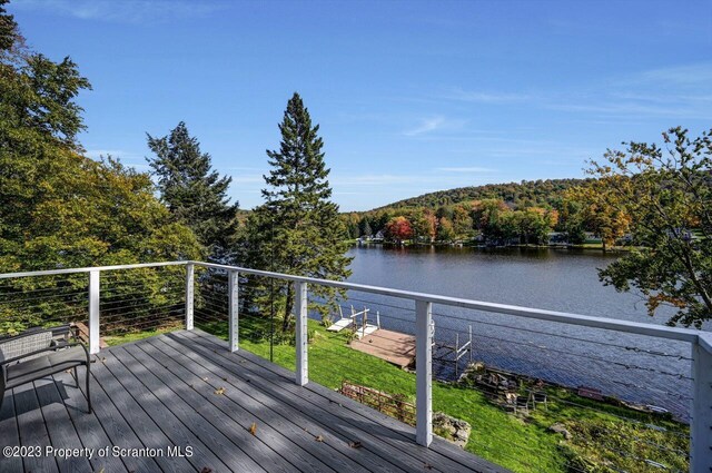 266 Warren Park Rd, New Milford, PA 18834 - wooden terrace featuring a water view and a wooded view