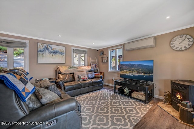 266 Warren Park Rd, New Milford, PA 18834 - living room with a wall unit AC, a wood stove, wood finished floors, baseboards, and crown molding