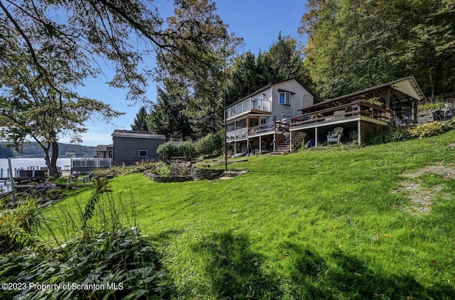266 Warren Park Rd, New Milford, PA 18834 - rear view of house featuring a deck and a lawn