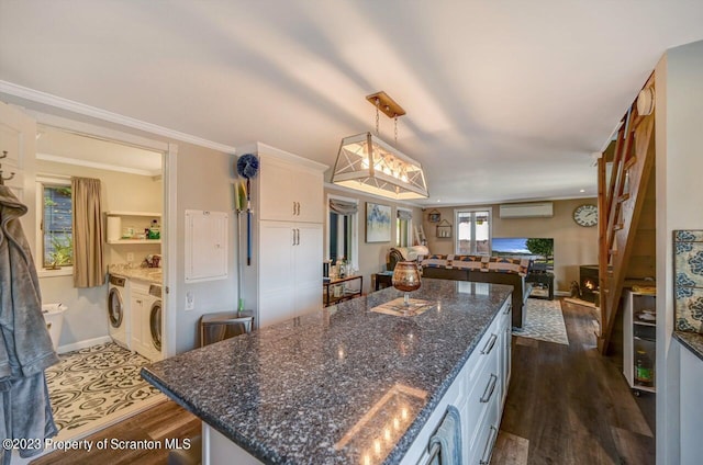 266 Warren Park Rd, New Milford, PA 18834 - kitchen featuring a wall mounted air conditioner, open floor plan, dark wood-style floors, a center island, and white cabinetry