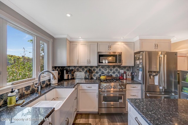 266 Warren Park Rd, New Milford, PA 18834 - kitchen with stainless steel appliances, backsplash, dark stone counters, a sink, and recessed lighting