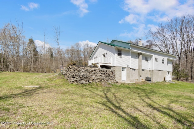 828 Lake Henry Rd, Lake Ariel, PA 18436 - view of side of home with a lawn and a chimney