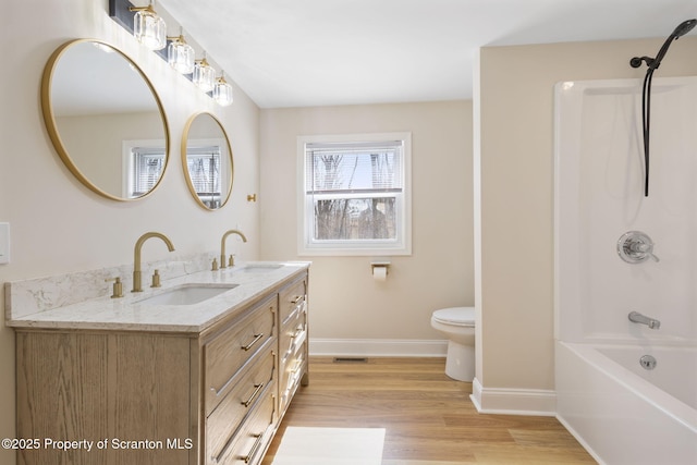 828 Lake Henry Rd, Lake Ariel, PA 18436 - full bath featuring baseboards, a sink, wood finished floors, and double vanity