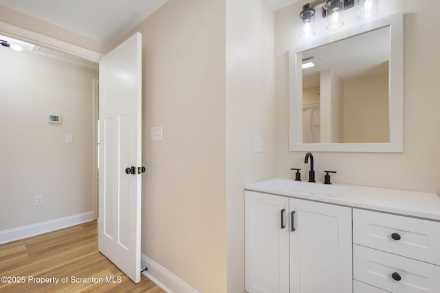 828 Lake Henry Rd, Lake Ariel, PA 18436 - bathroom with vanity, baseboards, and wood finished floors