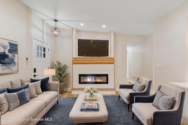 828 Lake Henry Rd, Lake Ariel, PA 18436 - living room with visible vents, wood finished floors, a fireplace, baseboards, and recessed lighting