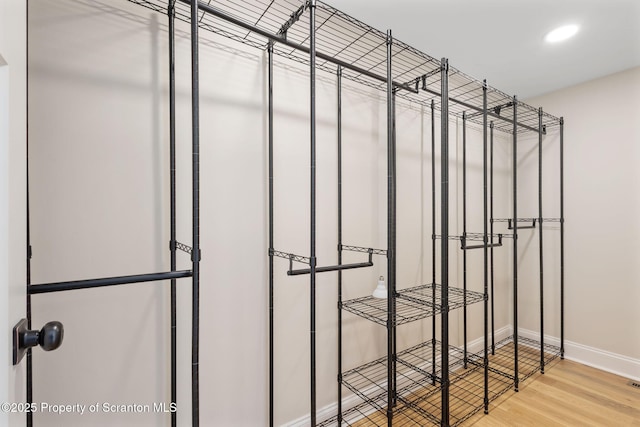828 Lake Henry Rd, Lake Ariel, PA 18436 - walk in closet with wood finished floors