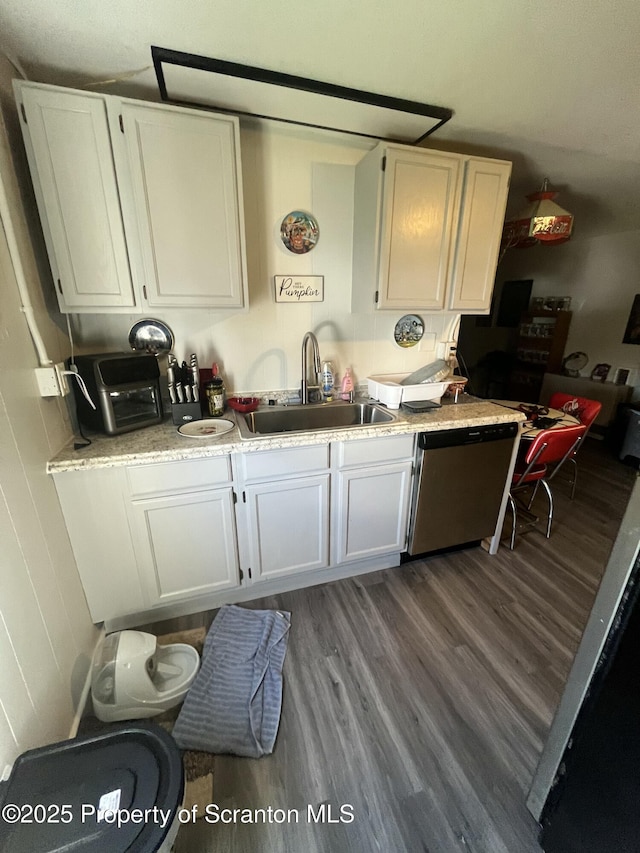 717719 Cedar Ave, Scranton, PA 18505 - kitchen with a sink, dishwasher, wood finished floors, and white cabinetry