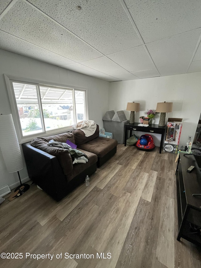 717719 Cedar Ave, Scranton, PA 18505 - living room featuring wood finished floors and a paneled ceiling