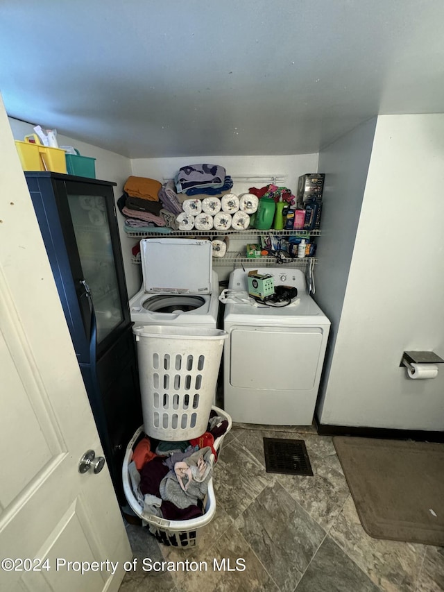 laundry room with independent washer and dryer