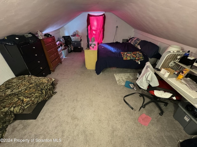 carpeted bedroom with vaulted ceiling