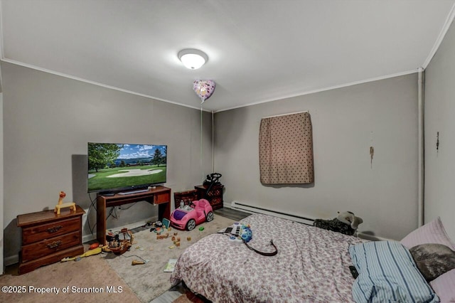 bedroom featuring a baseboard heating unit and crown molding