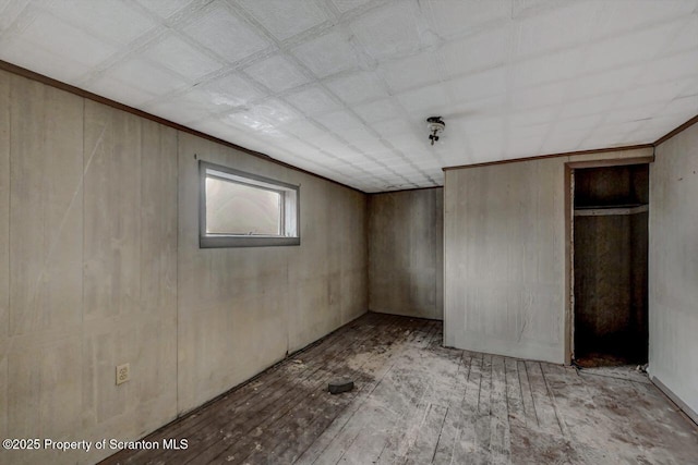 unfurnished bedroom featuring crown molding