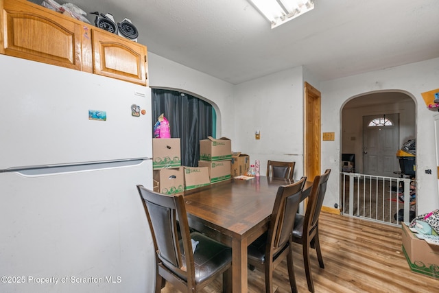 424 Hudson St, Forest City, PA 18421 - dining space with arched walkways and light wood finished floors