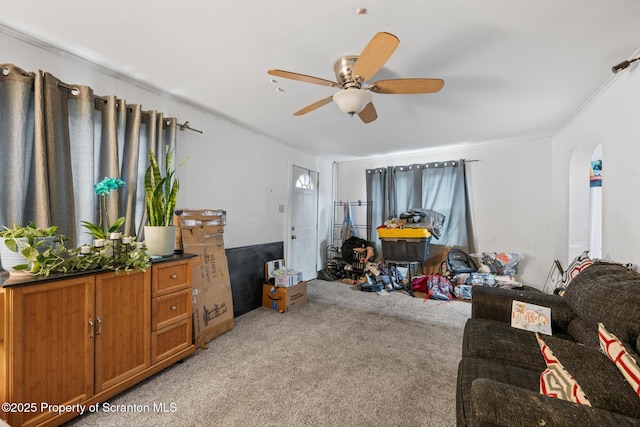 424 Hudson St, Forest City, PA 18421 - living area with light colored carpet, ceiling fan, and arched walkways