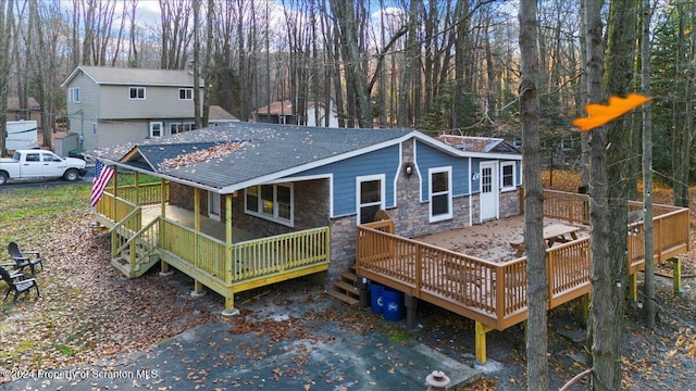 back of property with a deck