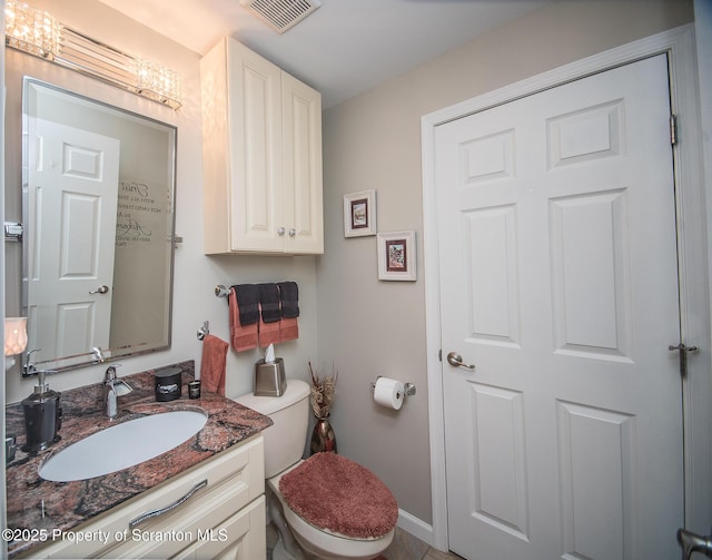 224 Shadow Wood Cir, Archbald, PA 18403 - half bath with visible vents, toilet, vanity, and baseboards