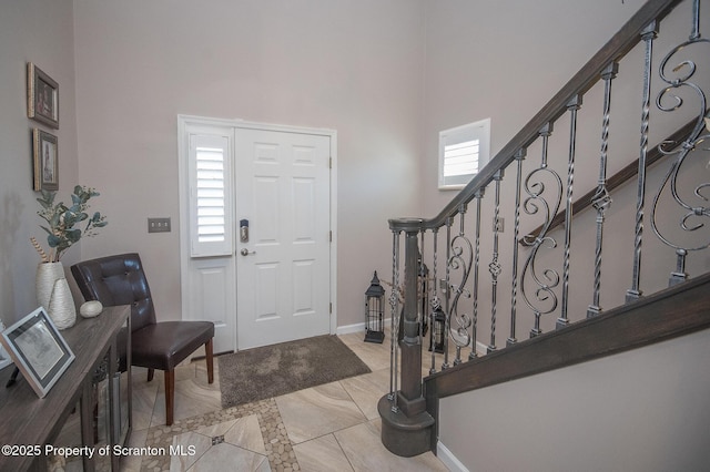 224 Shadow Wood Cir, Archbald, PA 18403 - tiled entrance foyer featuring baseboards, a high ceiling, and stairs