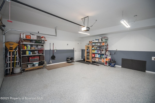 224 Shadow Wood Cir, Archbald, PA 18403 - garage featuring baseboards and a garage door opener