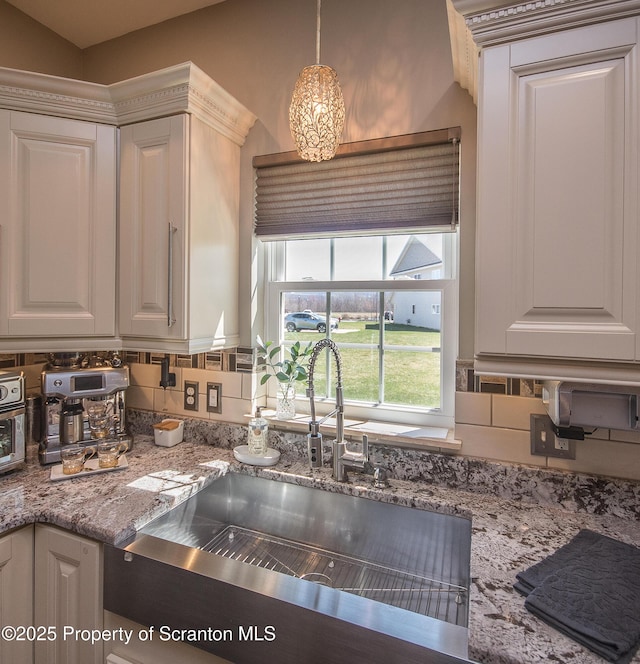 224 Shadow Wood Cir, Archbald, PA 18403 - kitchen with a sink, white cabinetry, and light stone counters