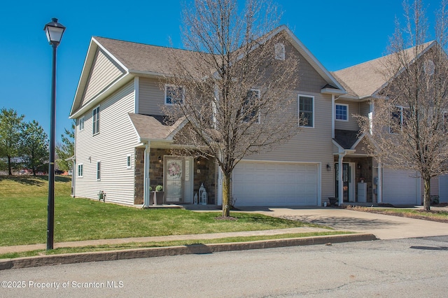 224 Shadow Wood Cir, Archbald, PA 18403 - traditional-style home featuring a shingled roof, an attached garage, stone siding, concrete driveway, and a front lawn