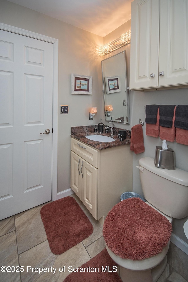 224 Shadow Wood Cir, Archbald, PA 18403 - half bathroom with toilet, tile patterned floors, vanity, and baseboards