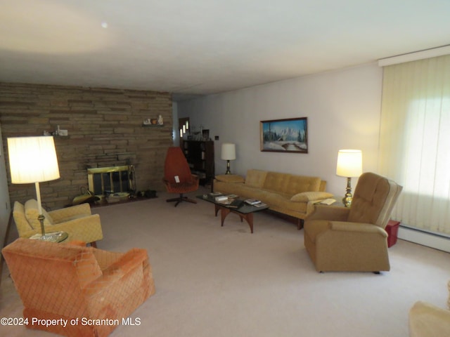 carpeted living room featuring a stone fireplace and a baseboard heating unit