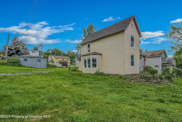 336 Grand Ave, Clarks Summit, PA 18411 - view of property exterior with a lawn and a shingled roof
