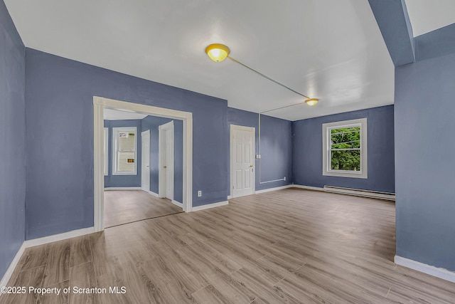 336 Grand Ave, Clarks Summit, PA 18411 - empty room featuring wood finished floors and a baseboard radiator