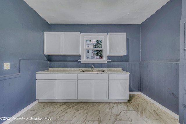 336 Grand Ave, Clarks Summit, PA 18411 - kitchen featuring white cabinetry and light marble finish floors
