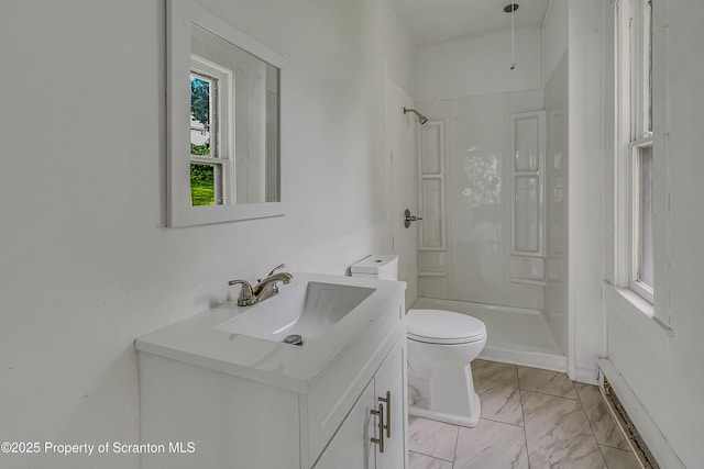 336 Grand Ave, Clarks Summit, PA 18411 - bathroom with vanity, a walk in shower, marble look tiles, and baseboard heating