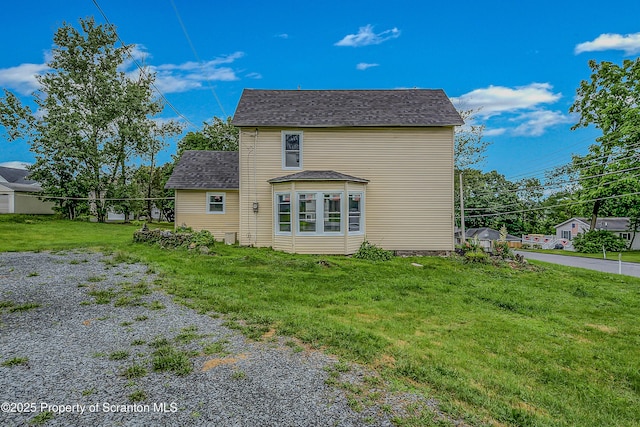 336 Grand Ave, Clarks Summit, PA 18411 - back of house with a lawn and a shingled roof