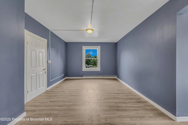 336 Grand Ave, Clarks Summit, PA 18411 - spare room with a baseboard heating unit and wood finished floors