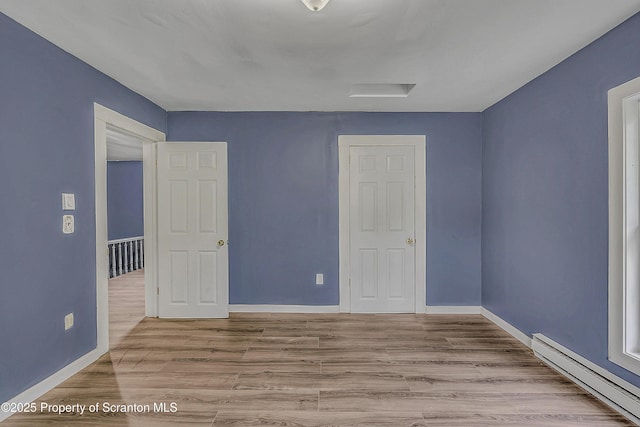 336 Grand Ave, Clarks Summit, PA 18411 - empty room with a baseboard radiator and wood finished floors