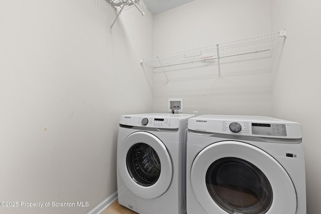 2103 Robinson Close, Moosic, PA 18507 - laundry area featuring washing machine and clothes dryer and baseboards