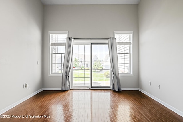 2103 Robinson Close, Moosic, PA 18507 - empty room with dark wood-style floors and healthy amount of natural light