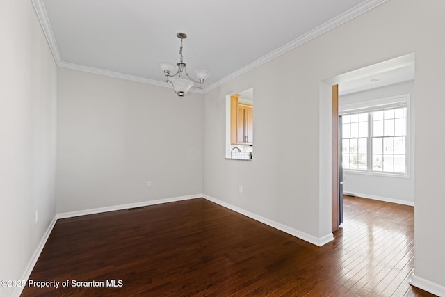 2103 Robinson Close, Moosic, PA 18507 - empty room featuring a chandelier, crown molding, and dark wood-style floors