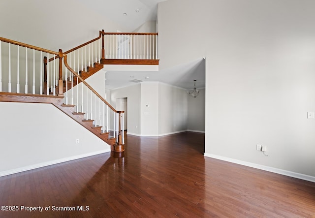 2103 Robinson Close, Moosic, PA 18507 - unfurnished living room with wood finished floors, stairway, high vaulted ceiling, and a chandelier