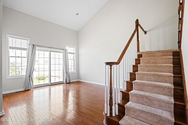 2103 Robinson Close, Moosic, PA 18507 - stairway with high vaulted ceiling and wood-type flooring