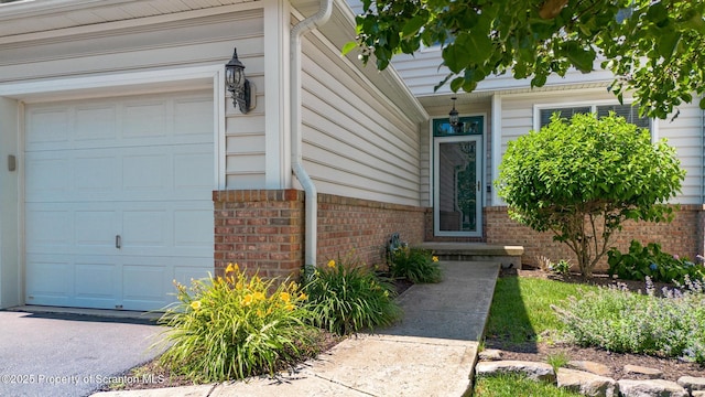 2103 Robinson Close, Moosic, PA 18507 - view of exterior entry with brick siding and a garage
