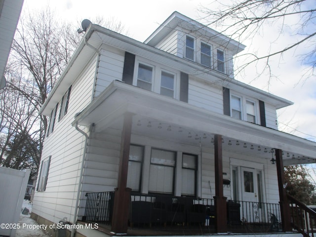 traditional style home featuring a porch