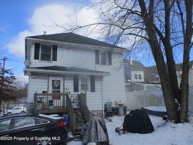 view of front of house featuring a shingled roof