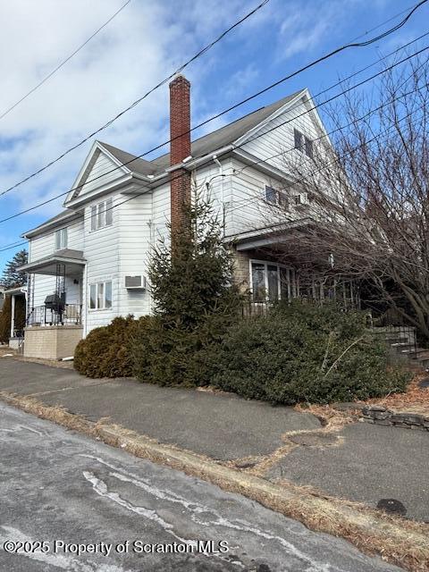 view of home's exterior with covered porch